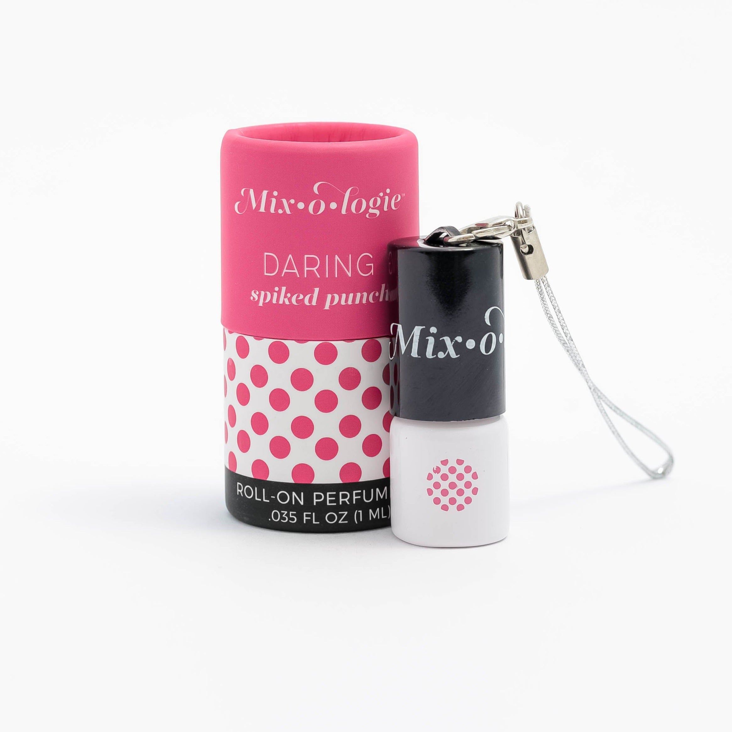 Daring (Spiked Punch) mini white cylinder rollerballs with black top and keychain attachment lid with bright pink polka dots has .035 fl oz or 1 mL.