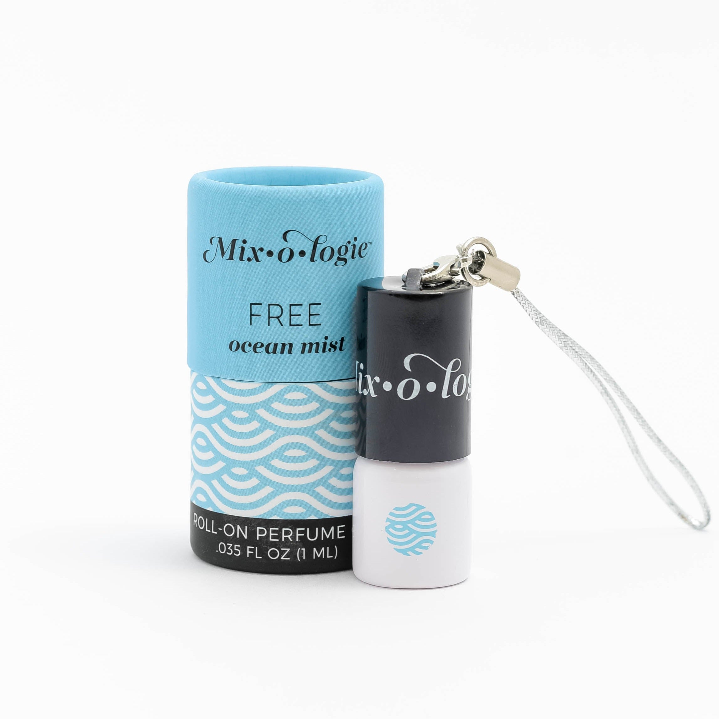 Mixologie's Free (ocean mist) scented mini rollerball in 1 mL bottle with keychain lid. displayed with cylinder packaging.