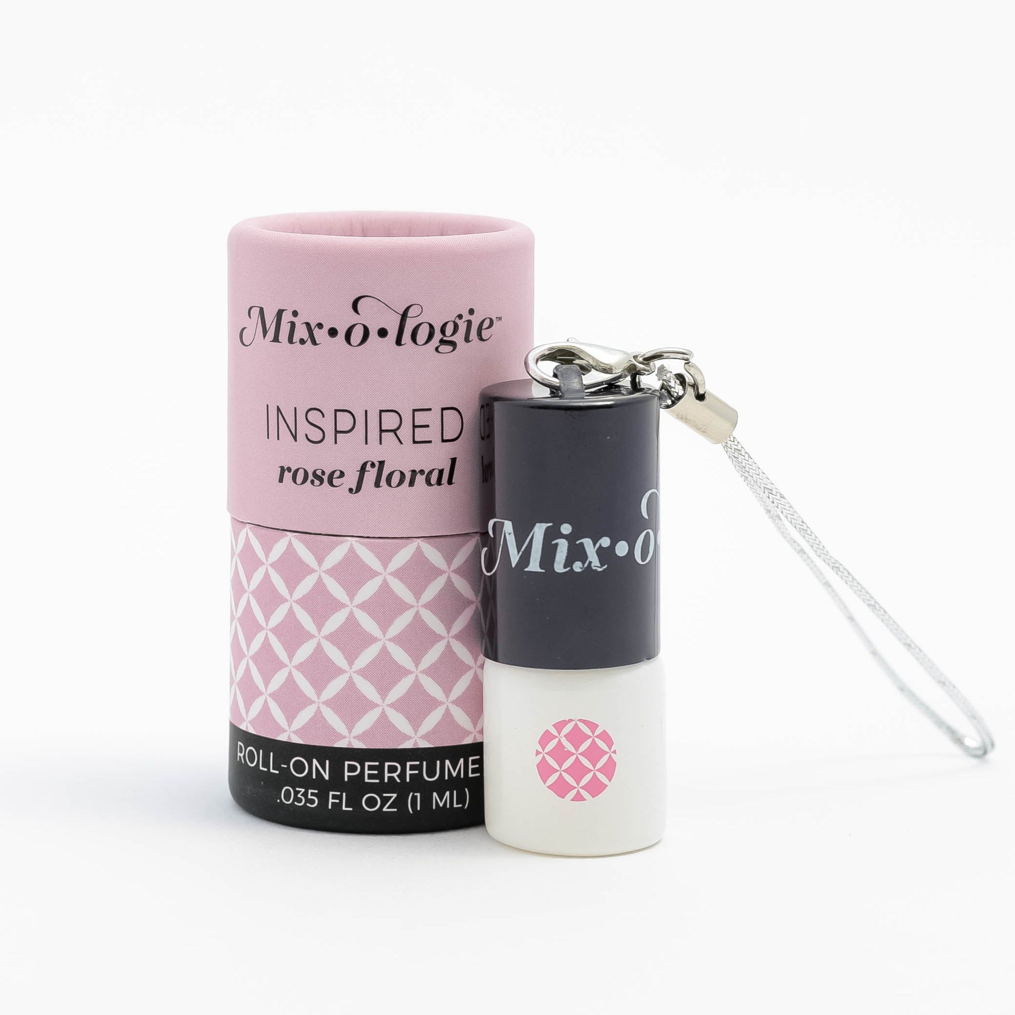 Mixologie's Inspired (rose floral) scented mini rollerball in 1 mL bottle with keychain lid. displayed with cylinder packaging