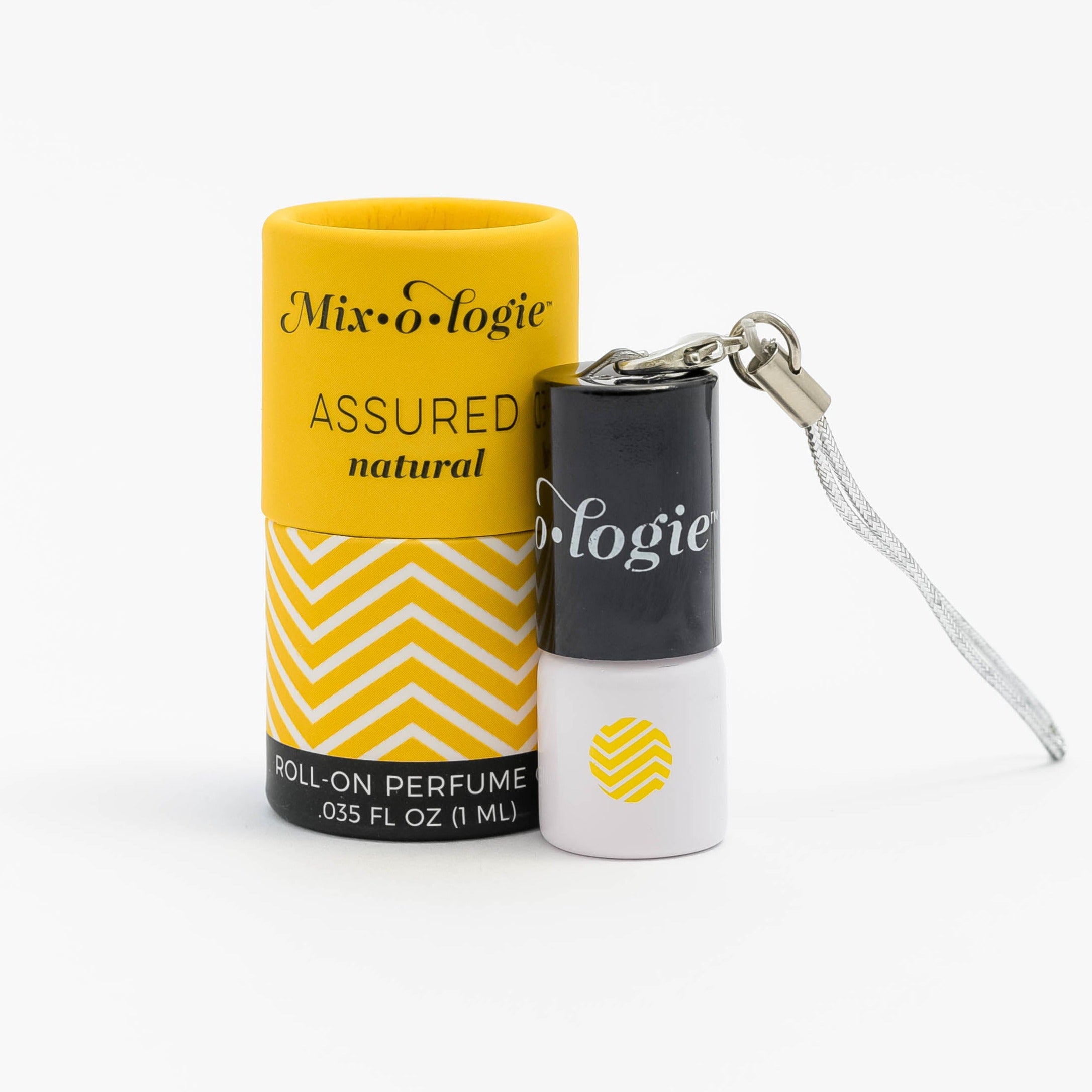 Mixologie's Assured (Natural) scented mini rollerball in 1 mL bottle with keychain lid. Displayed with yellow and white cylinder packaging.