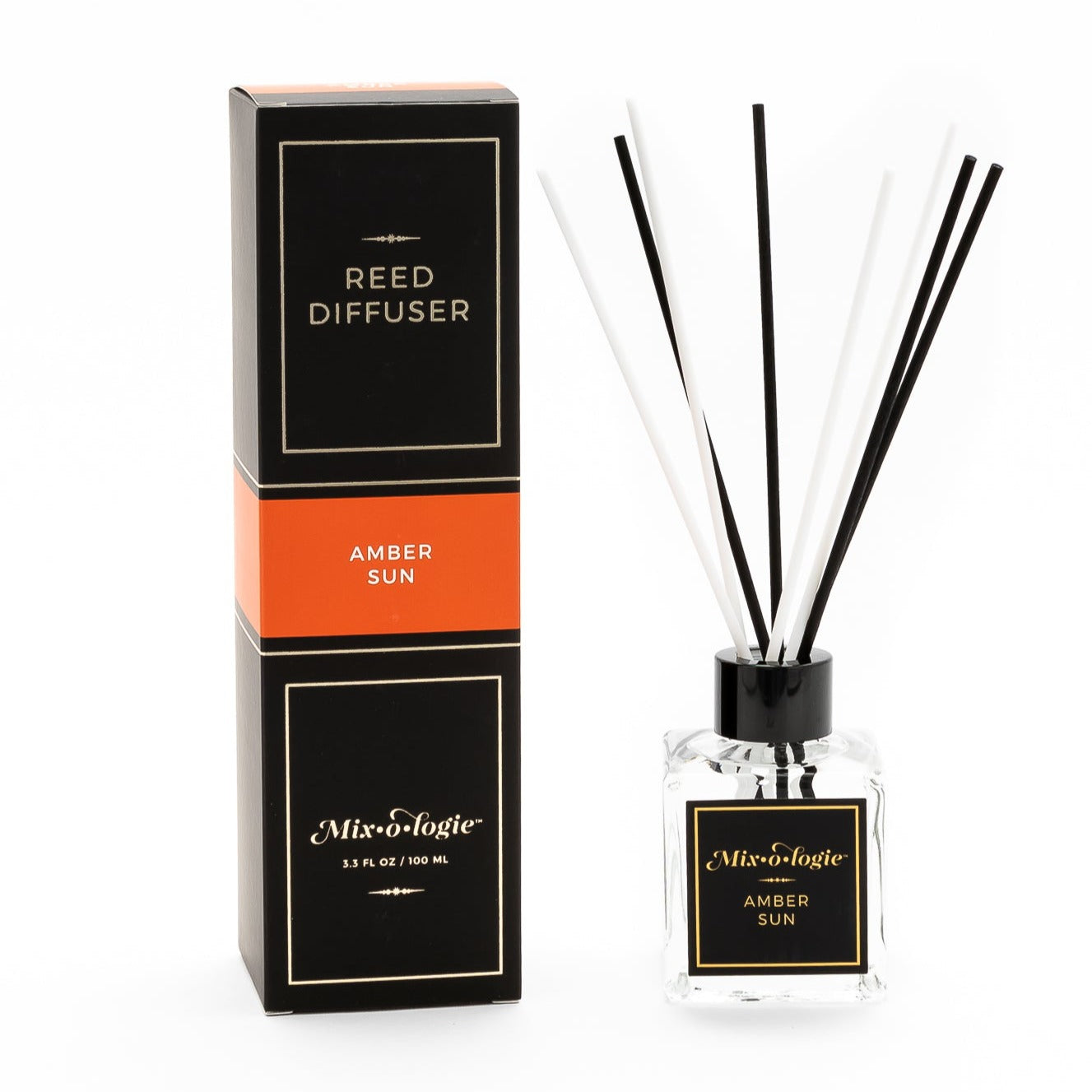 Mixologie Amber Sun scented Reed Diffuser 3.3 FL oz clear glass bottle with 8 diffuser reed sticks.