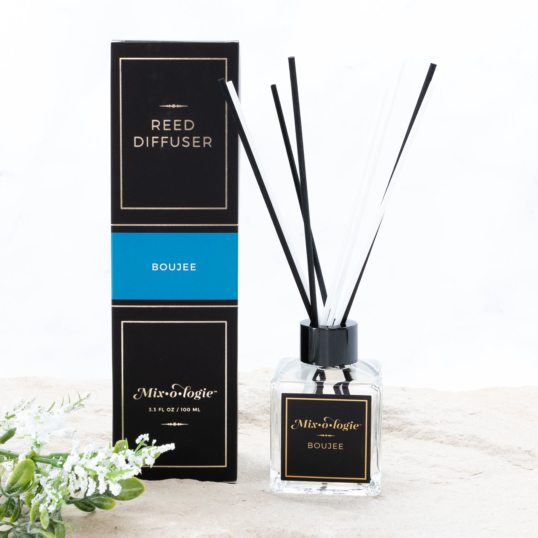 Mixologie Boujee scented Reed Diffuser with 8 reed diffuser sticks in 3.5 FL OZ glass bottle. 