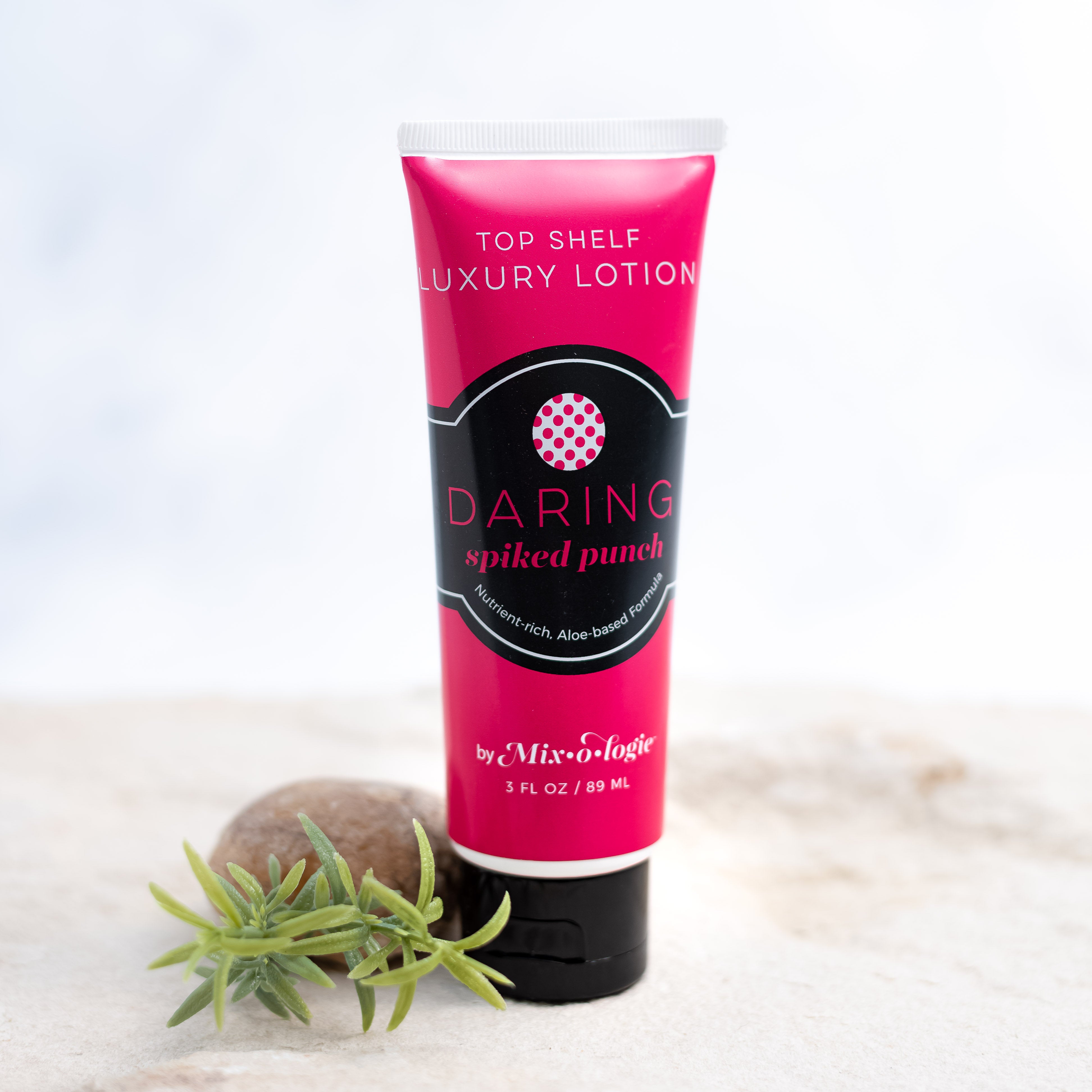 Daring (Spiked Punch) Top Shelf Lotion in bright pink tube with black lid and label. Nutrient rich, aloe-based formula, tube has 5 fl oz or 89 mL.