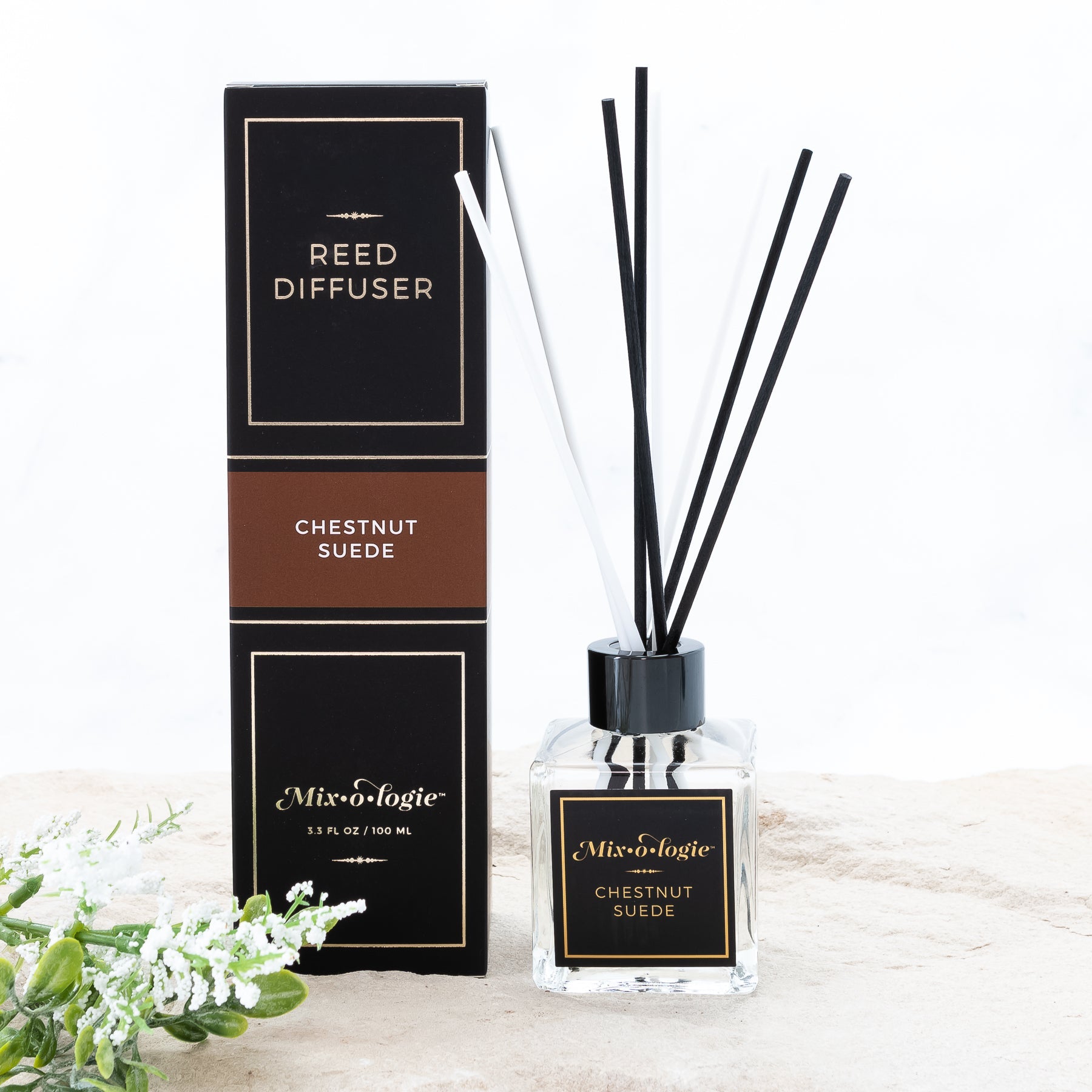100 mL glass bottle reed diffuser scented with Mixologie's Chestnut Suede with 8 reed sticks.