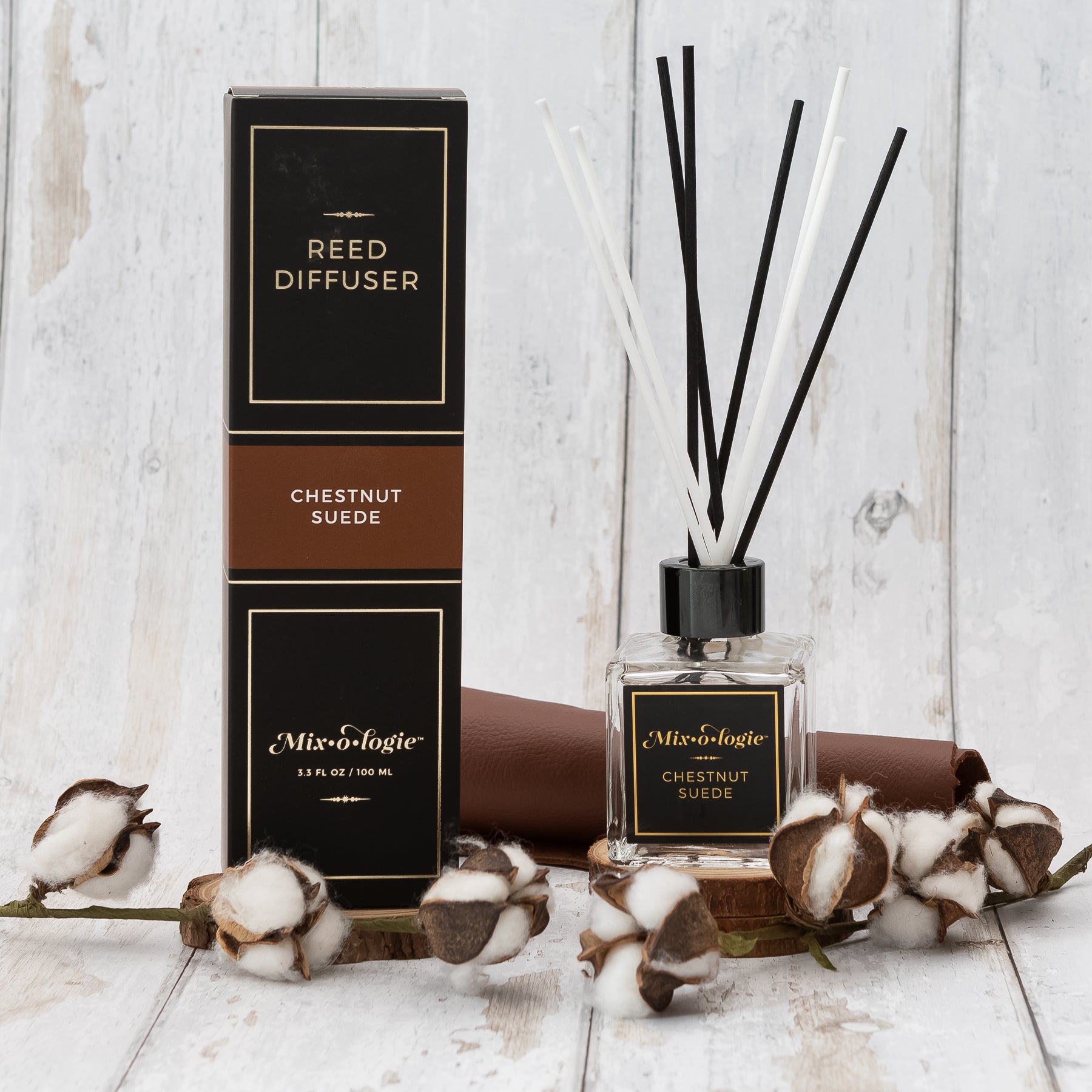 100 mL glass bottle reed diffuser scented with Mixologie's Chestnut Suede with 8 reed sticks.